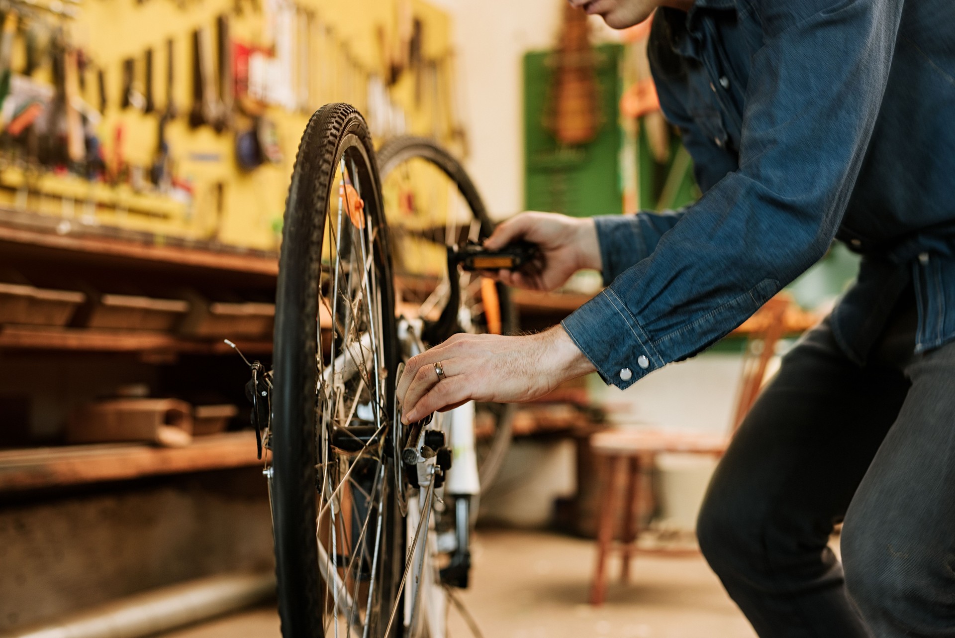 Man preparing bicycle for spring in his garage